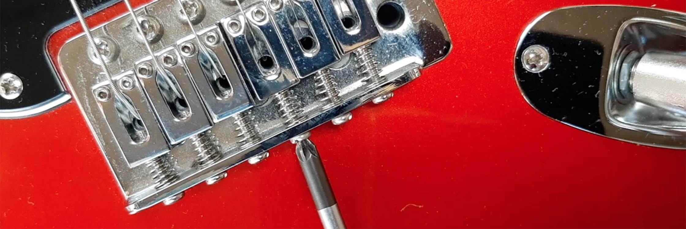 Guitar intonation – adjusting a saddle on an electric guitar bridge