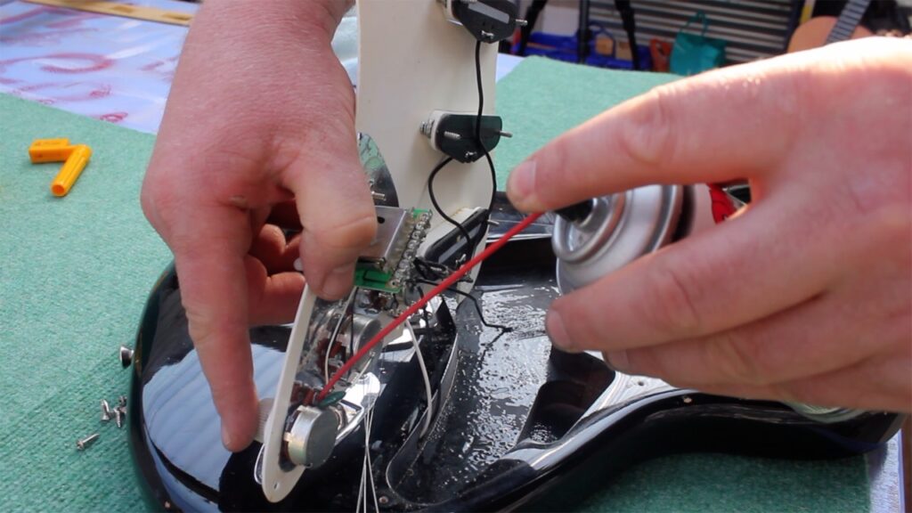 Guitar maintenance – working on the wiring inside an electric guitar