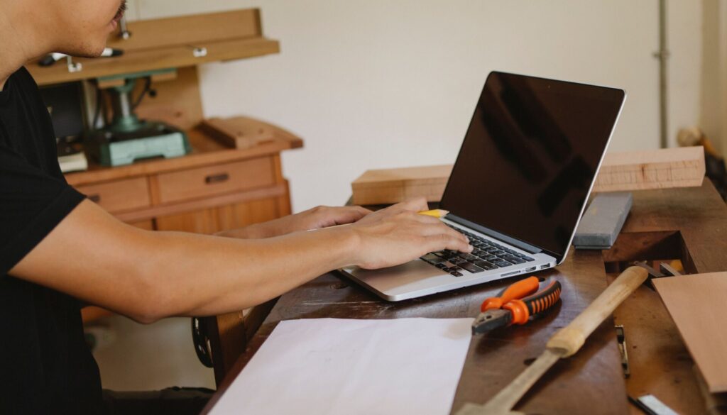 Retraining courses – learning a practical skill at a workbench with a laptop