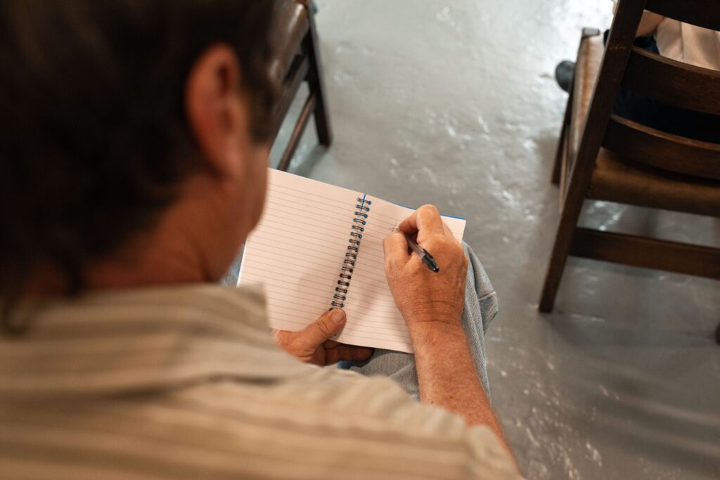 Employability courses – adult learner making notes at home
